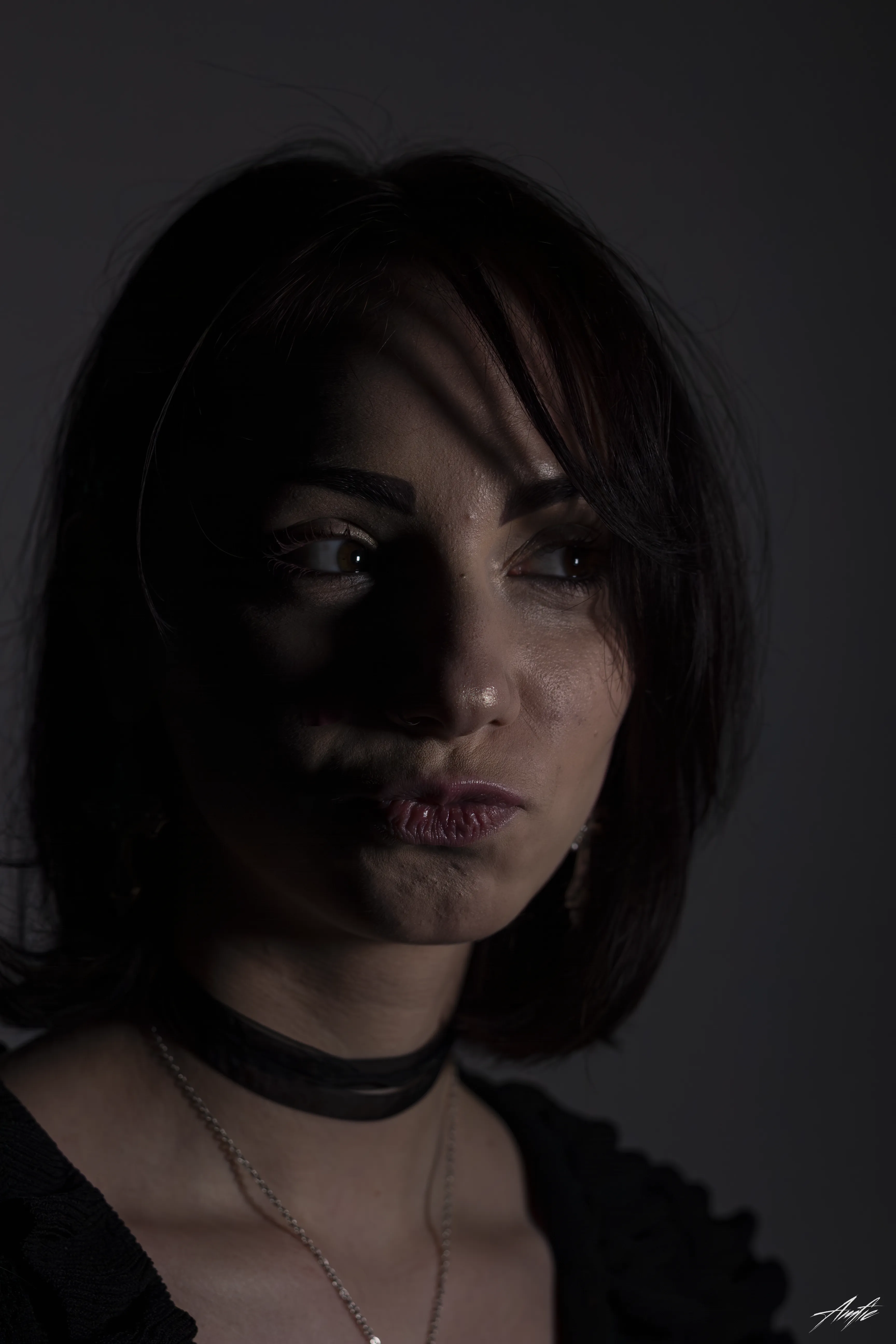 Medium close up portrait of a woman with a thoughtful expression