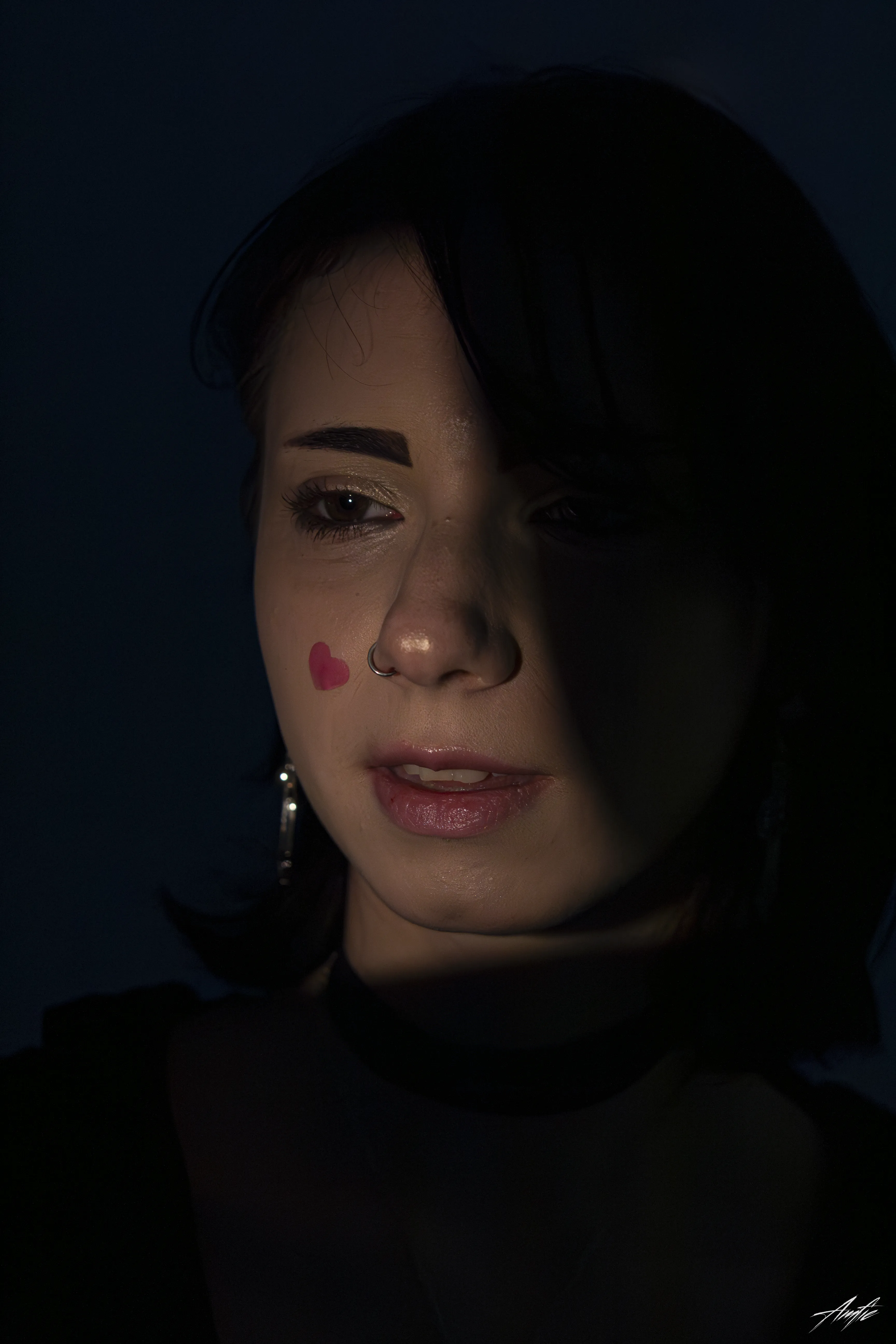 Medium close up portrait of a woman with a thoughtful expression