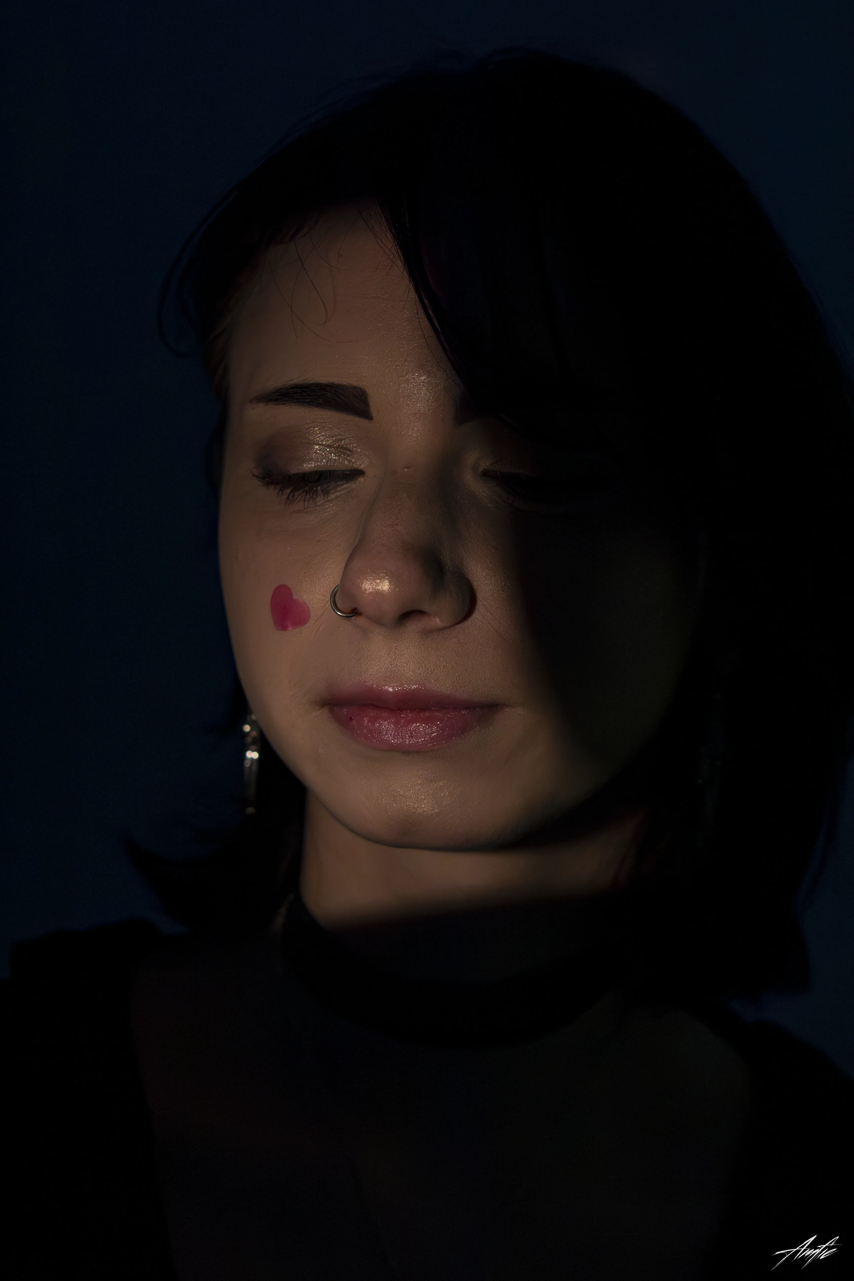 Medium close up portrait of a woman with a thoughtful expression