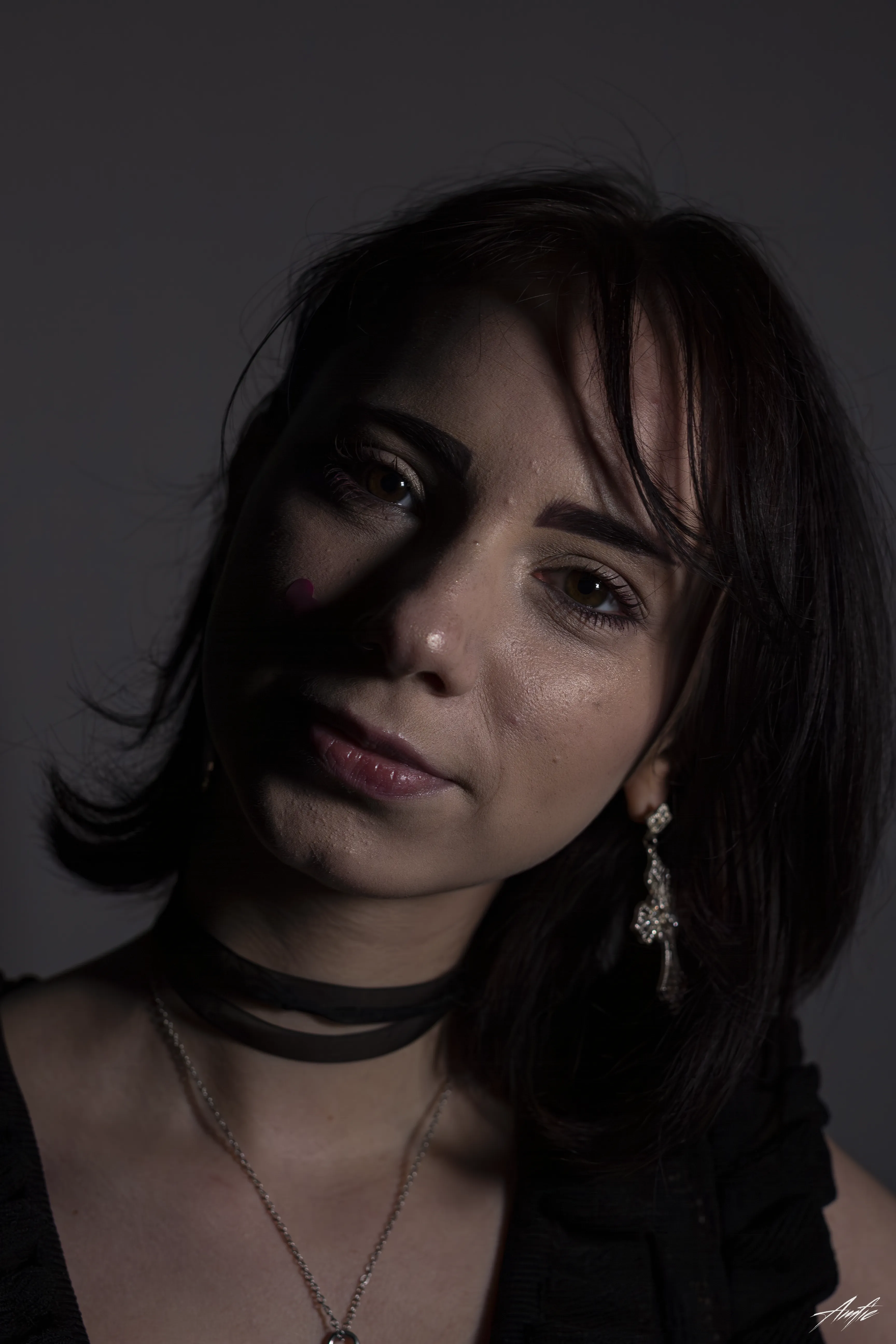Medium close up portrait of a woman with a thoughtful expression